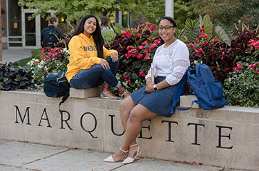 Students smiling. Links to Joanne Topham, BUS AD ’70 story
