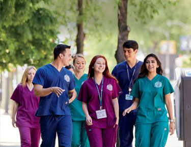 Med students walking on campus